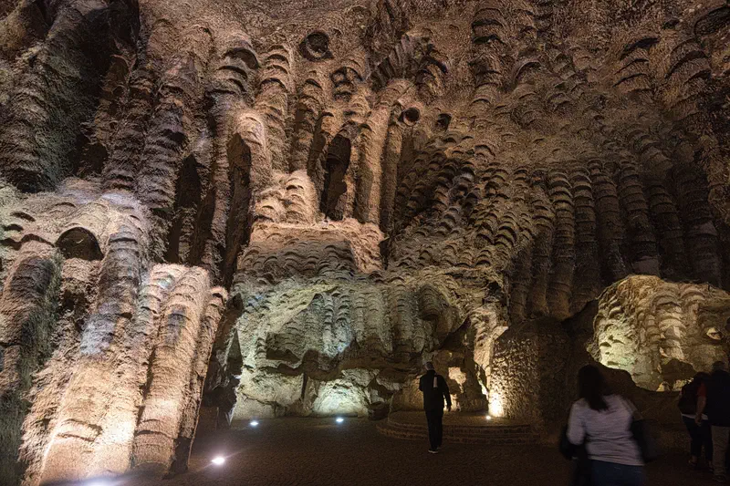 They cut grinding stones from the walls of the cave. Apparently, s…